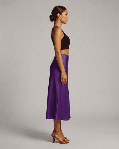 Amethyst Midi Skirt by SLIMONA, showcasing elegant satin mermaid design in vibrant purple color.