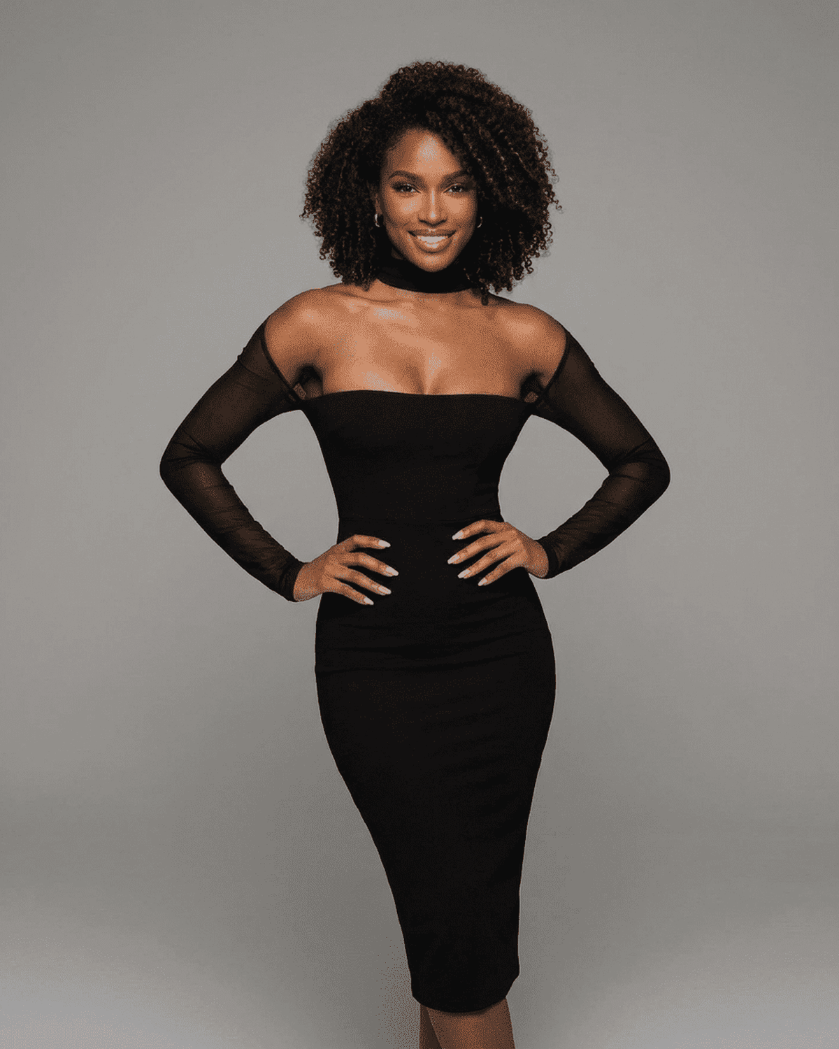 Model showcasing the SLIMONA Arden Midi Dress with cut out long sleeves in black, highlighting elegance and confidence.