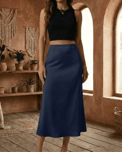 Astra Midi Skirt by SLIMONA in navy blue, showcasing an elegant satin mermaid design for a flattering silhouette.