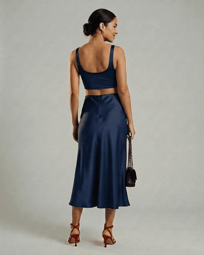 Astra Midi Skirt by SLIMONA - Elegant satin mermaid midi skirt in navy, showcasing a flattering silhouette and flow.