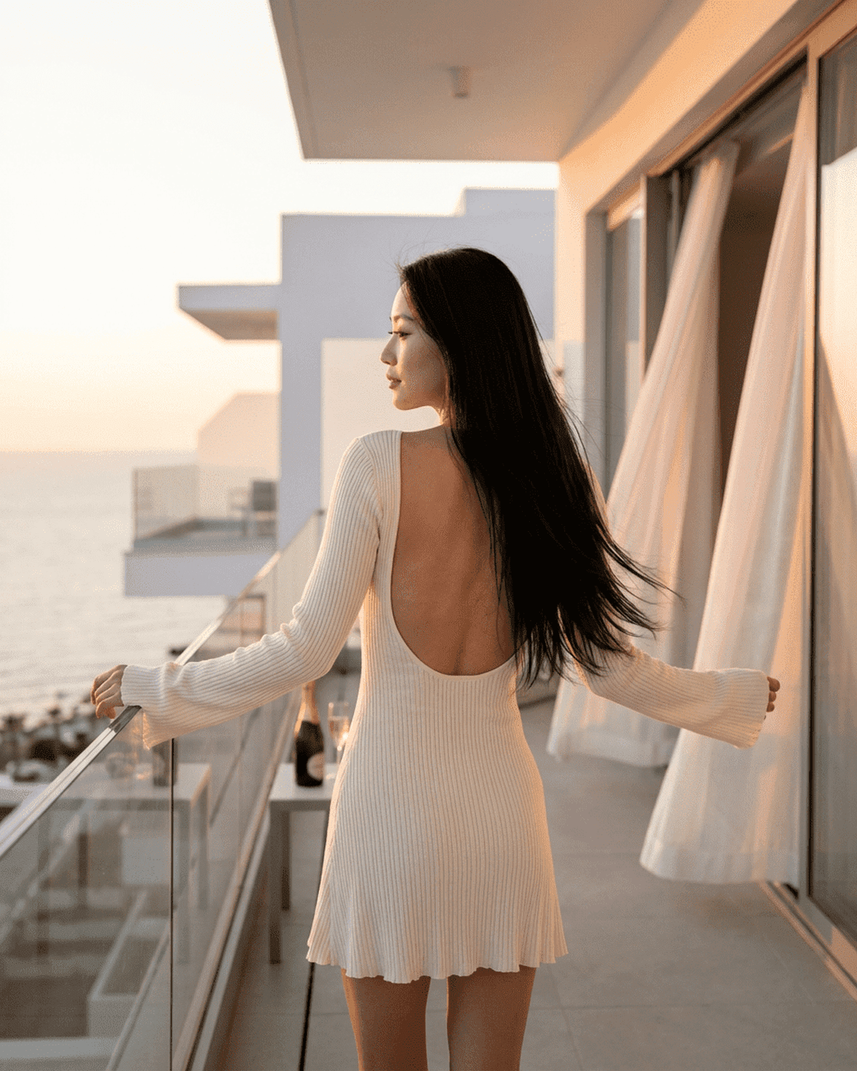 Celeste Mini Dress by SLIMONA, featuring a sexy open back and long sleeves, perfect for modern elegance.