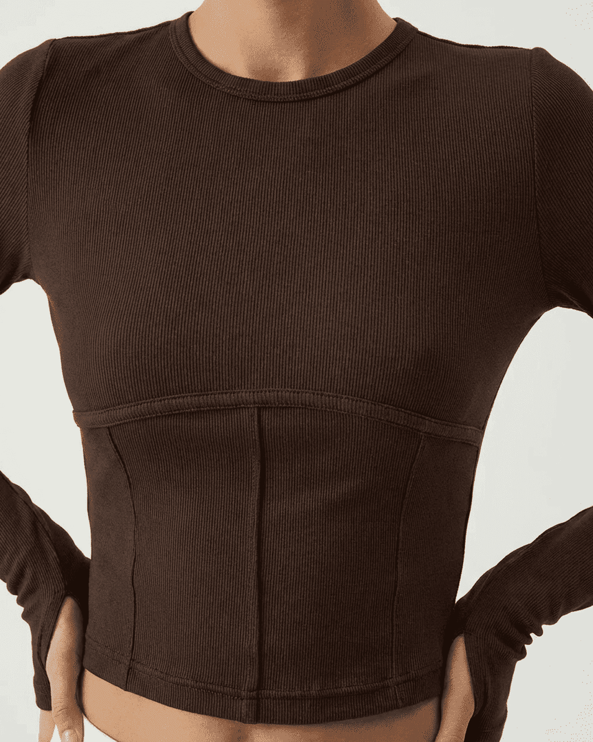 Cocoa Corset Top by SLIMONA in soft jersey with long sleeves and structured design.