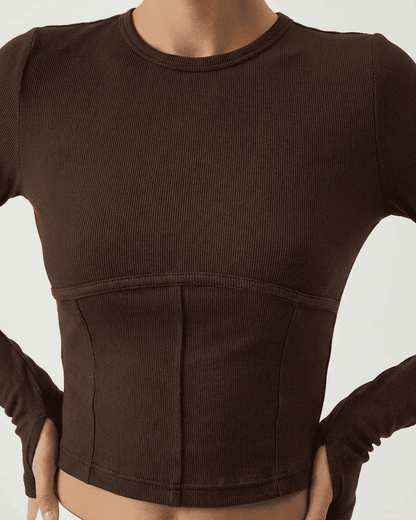 Cocoa Corset Top by SLIMONA in soft jersey with long sleeves and structured design.