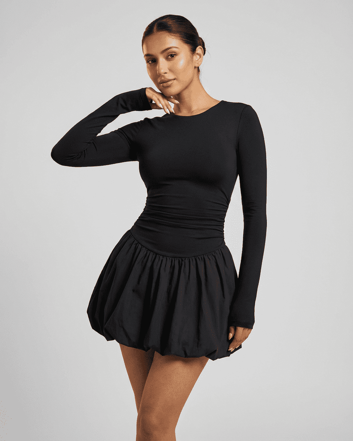 Elara Mini Dress by SLIMONA - Fitted long sleeve mini dress with a tiered skirt and elegant neckline.
