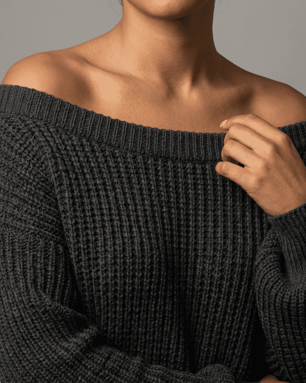 Ember Mini Dress by SLIMONA featuring a cozy ribbed knit off-the-shoulder design in deep charcoal.