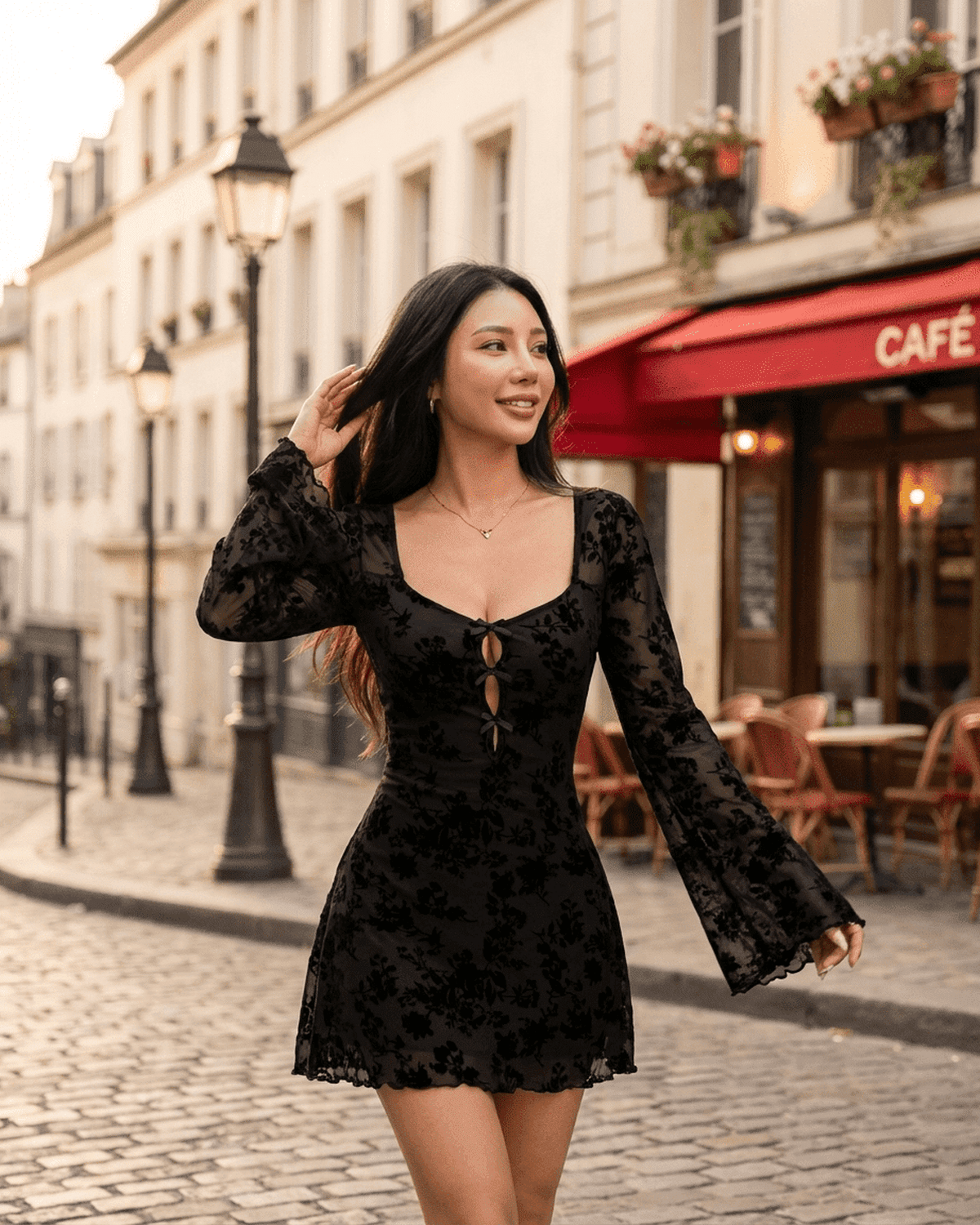 Fleur Mini Dress by SLIMONA – Flocked floral cutout bow long sleeve bodycon dress in black on a Parisian street.