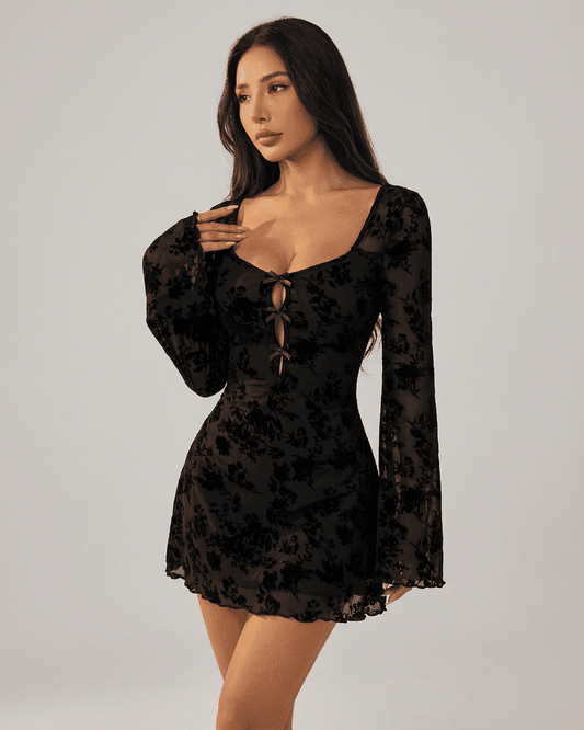 Fleur Mini Dress by SLIMONA featuring floral flocking, long flared sleeves, and stylish cutouts.