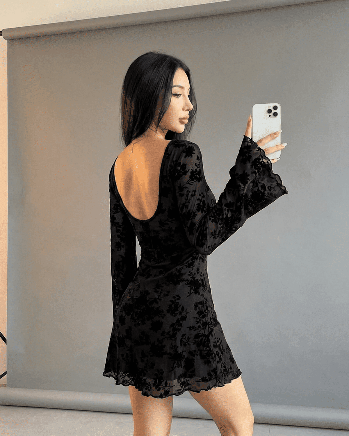 Fleur Mini Dress by SLIMONA featuring a backless design, flared sleeves, and elegant floral cutouts.