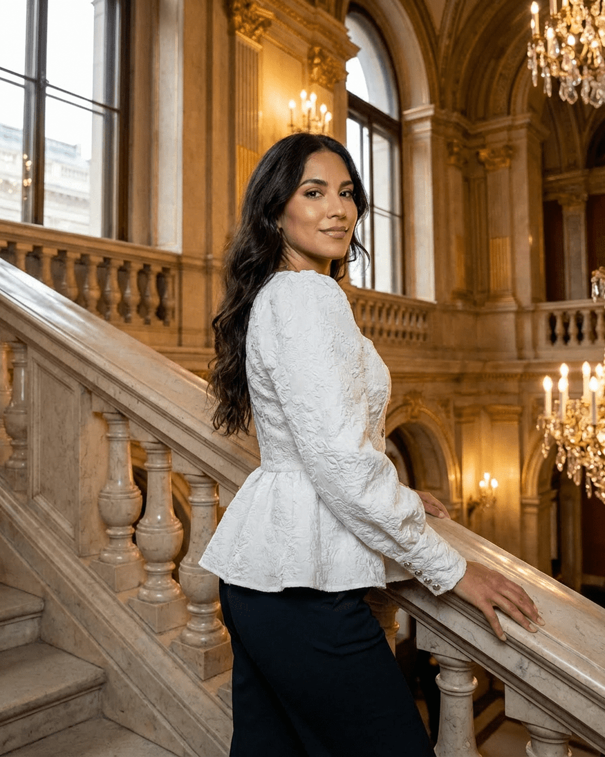 Ivory Corset Top by SLIMONA, featuring elegant jacquard design and puff sleeves, showcased in a grand staircase setting.