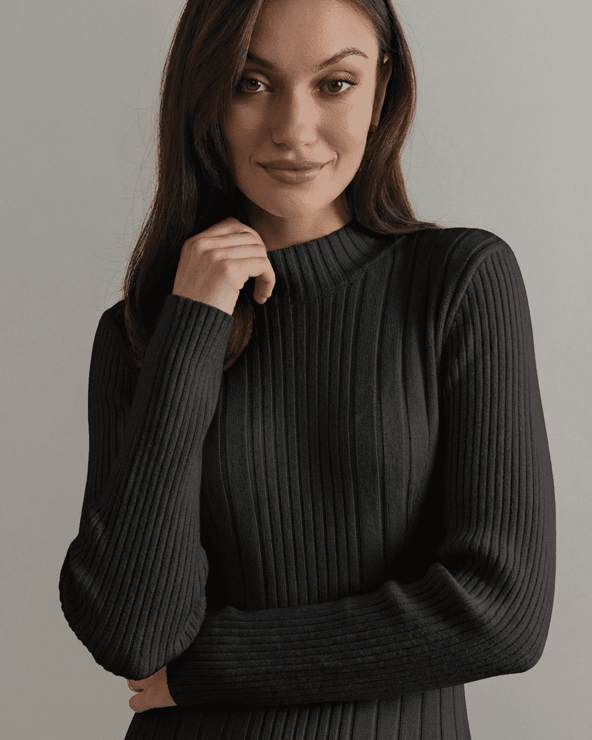 Model wearing the Milano Mini Dress by SLIMONA, featuring ribbed knit and mock neck, showcasing a contemporary look.