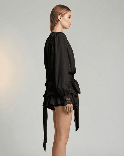 Noir Mini Dress by SLIMONA, showcasing lace detail and a tiered silhouette in elegant black.