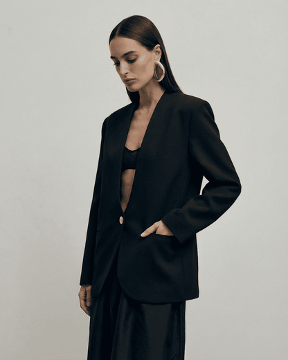 Obsidia Blazer by SLIMONA, fitted black blazer with deep V-neckline and tailored silhouette.