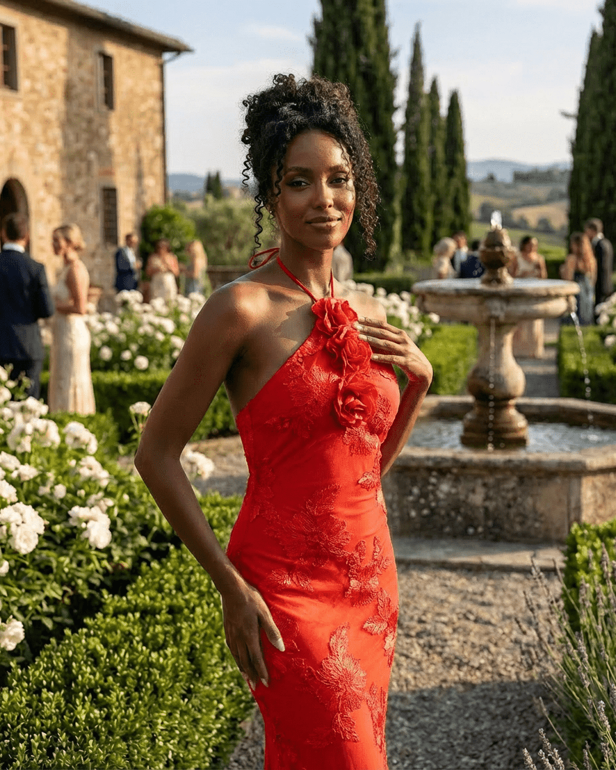 Rosalia Maxi Dress by SLIMONA worn by a model in a lush garden setting, showcasing the 3D floral details.