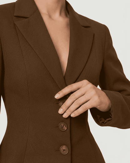 Sienna Blazer by SLIMONA features a fitted waist, V-neckline, and elegant brown fabric for modern workwear.
