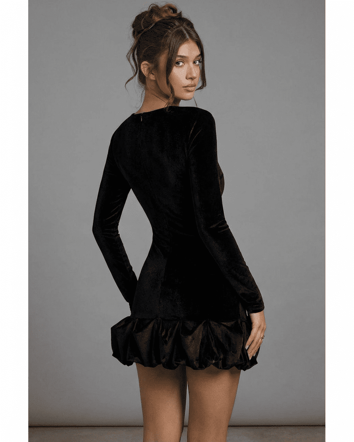 Velora Mini by SLIMONA, black velvet bodycon dress featuring pleated hem and long sleeves, perfect for a chic look.