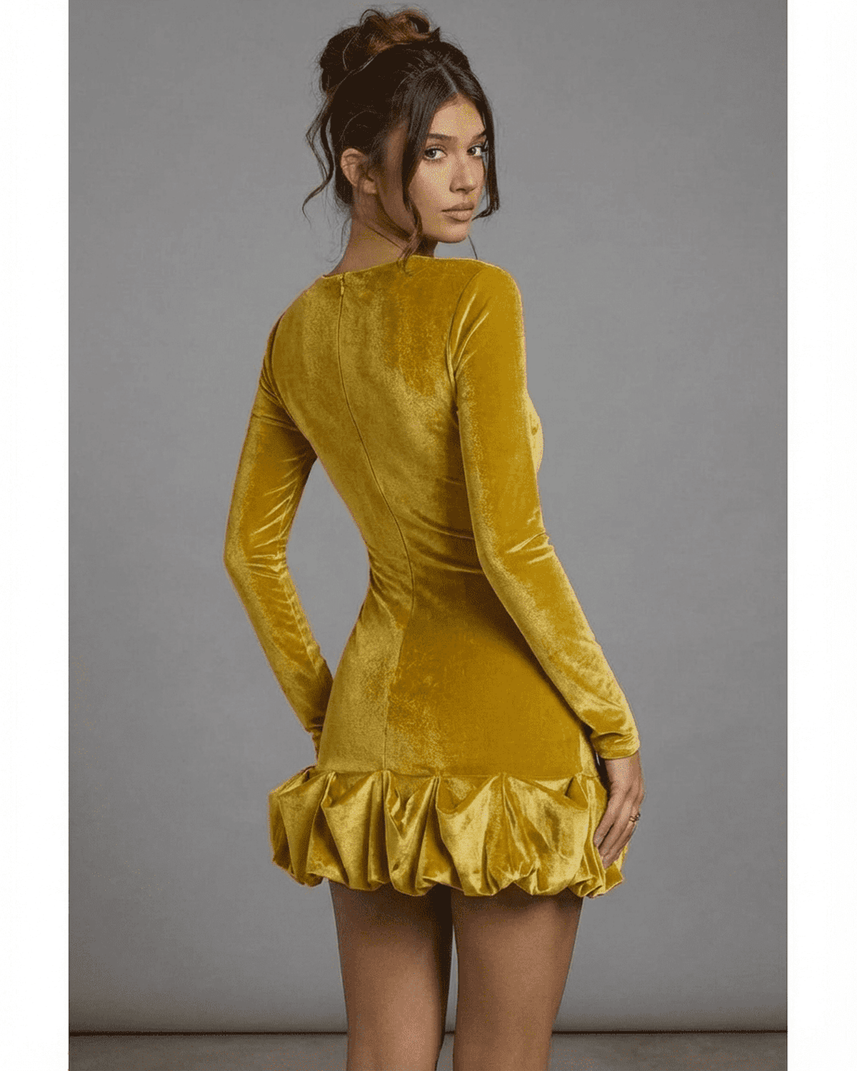 Velora Mini Yellow dress by SLIMONA showcasing luxurious velvet fabric and a pleated hem, perfect for evening wear.