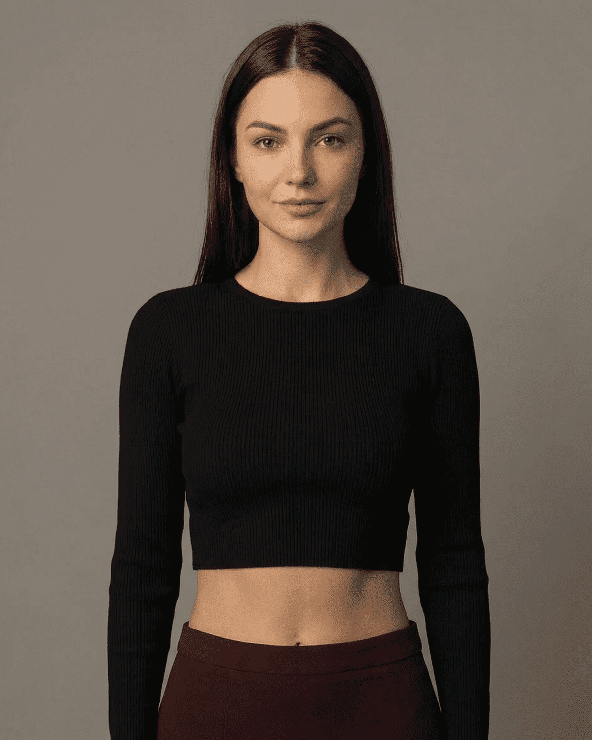 Merlot Maxi Skirt model wearing a stylish black crop top, showcasing modern elegance and a polished look.