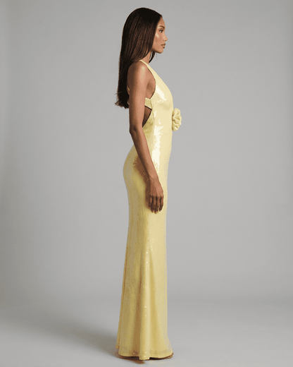 Solara Maxi Dress by SLIMONA - Backless V-Neck Yellow Dress with Floral Sequin Detail, showcased from the side.
