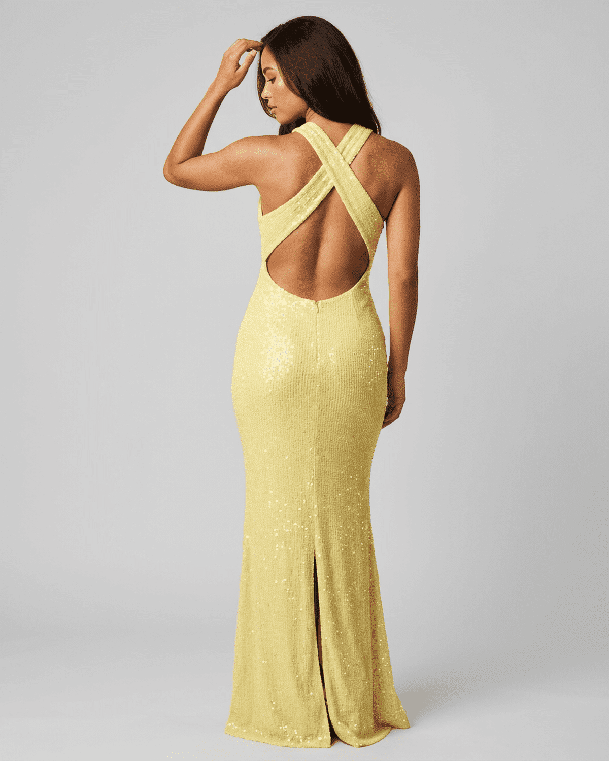 Solara Maxi Dress by SLIMONA, showcasing a stunning backless design and sequin details in vibrant yellow.