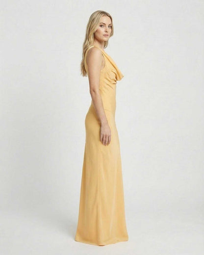 Solara Maxi Dress by SLIMONA, showcasing a satin-effect cowl neck and bodycon silhouette in a soft yellow tone.