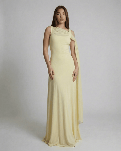 Solenne Maxi Dress by SLIMONA - Light yellow slip maxi dress with square neck and mesh shawl detail.