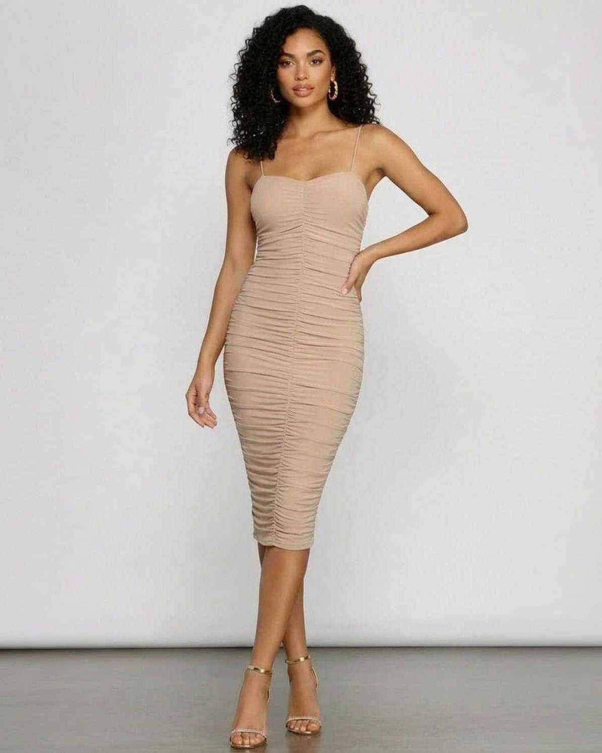 Solenne Midi Dress by SLIMONA, showcasing a sweetheart neckline and ruched bodycon silhouette, perfect for evening wear.