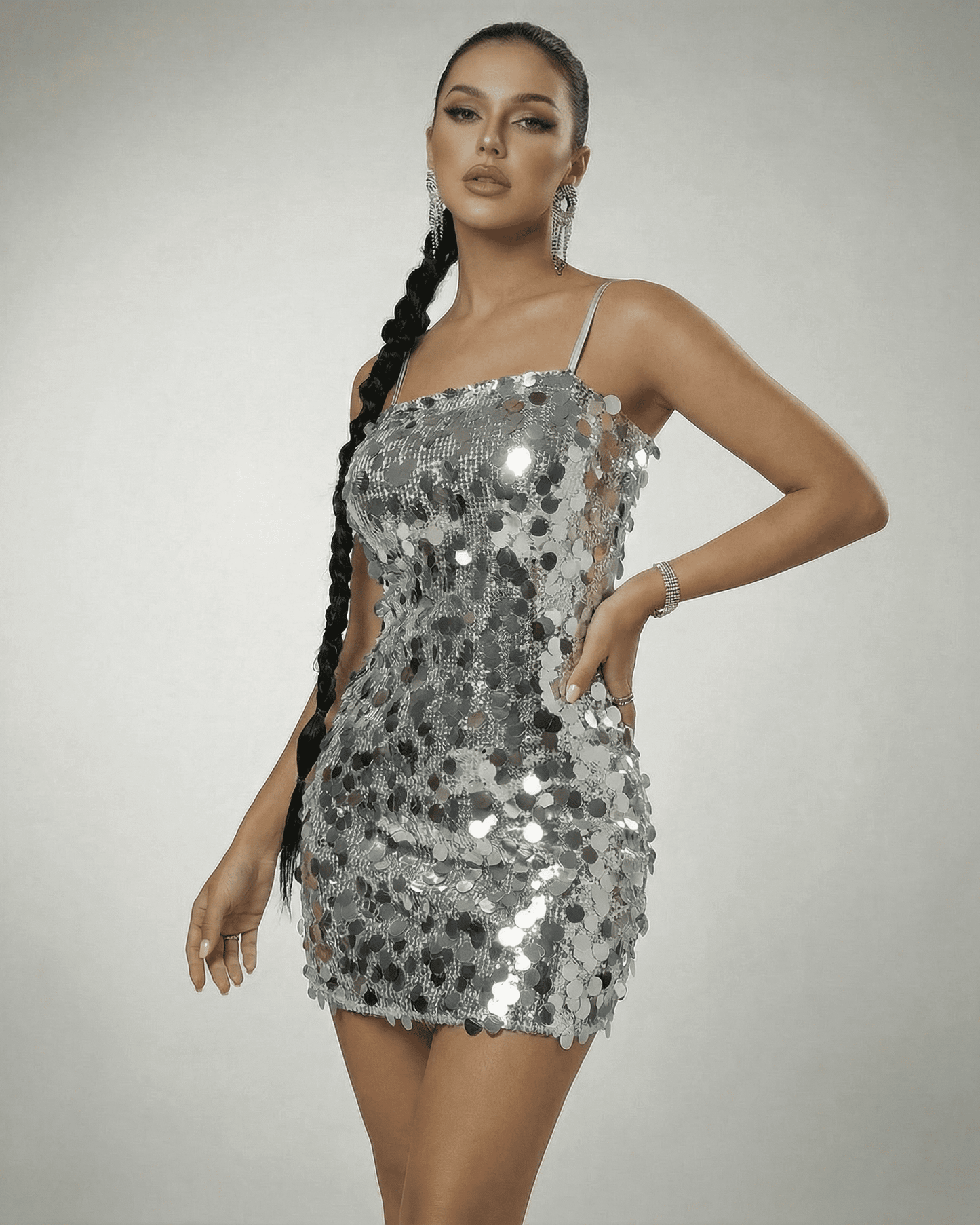 Stella Mini Dress by SLIMONA - silver sequin off-the-shoulder design highlighting a high-waist silhouette.