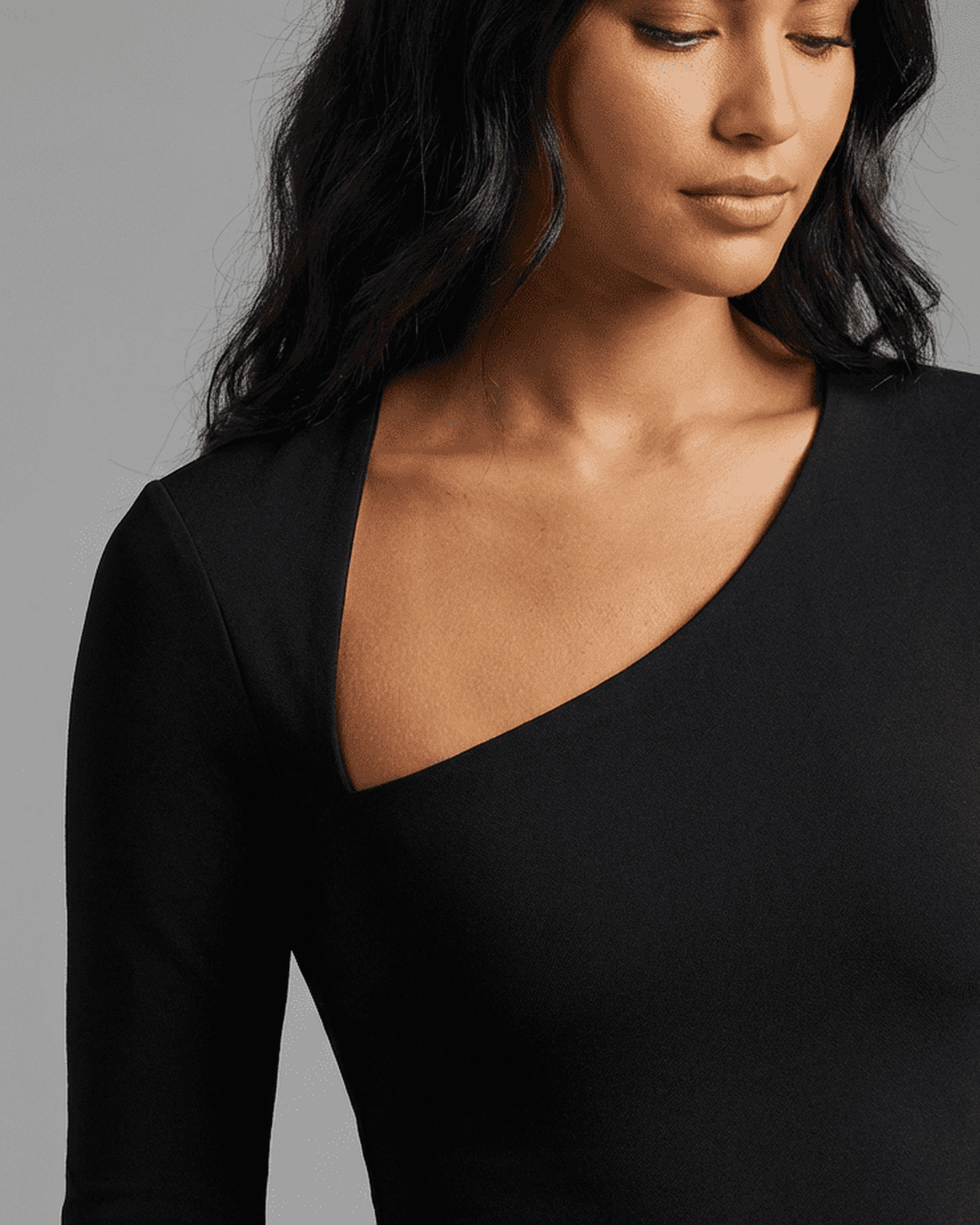 Close-up of the stylish one-shoulder neckline of the Vega Midi Dress by SLIMONA.
