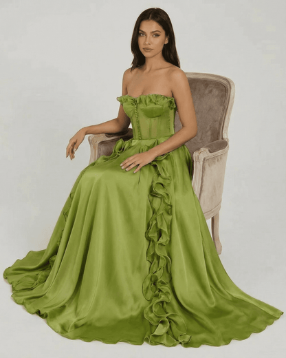 Elegant strapless Verdessa Maxi Dress by SLIMONA in green with ruffle detail and flowing silhouette.